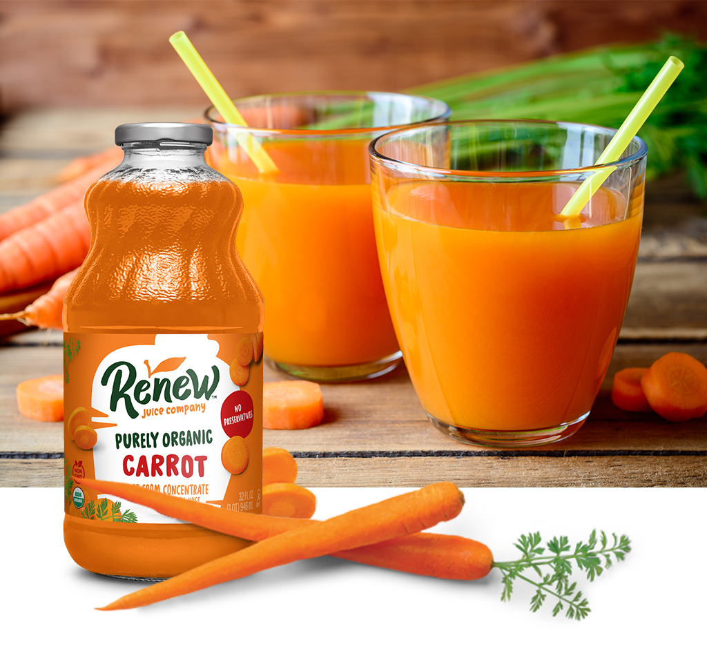 Bottle of Renew Purely Organic Carrot Juice with carrots around it and glasses of carrot juice sitting on top of a wood surface.
