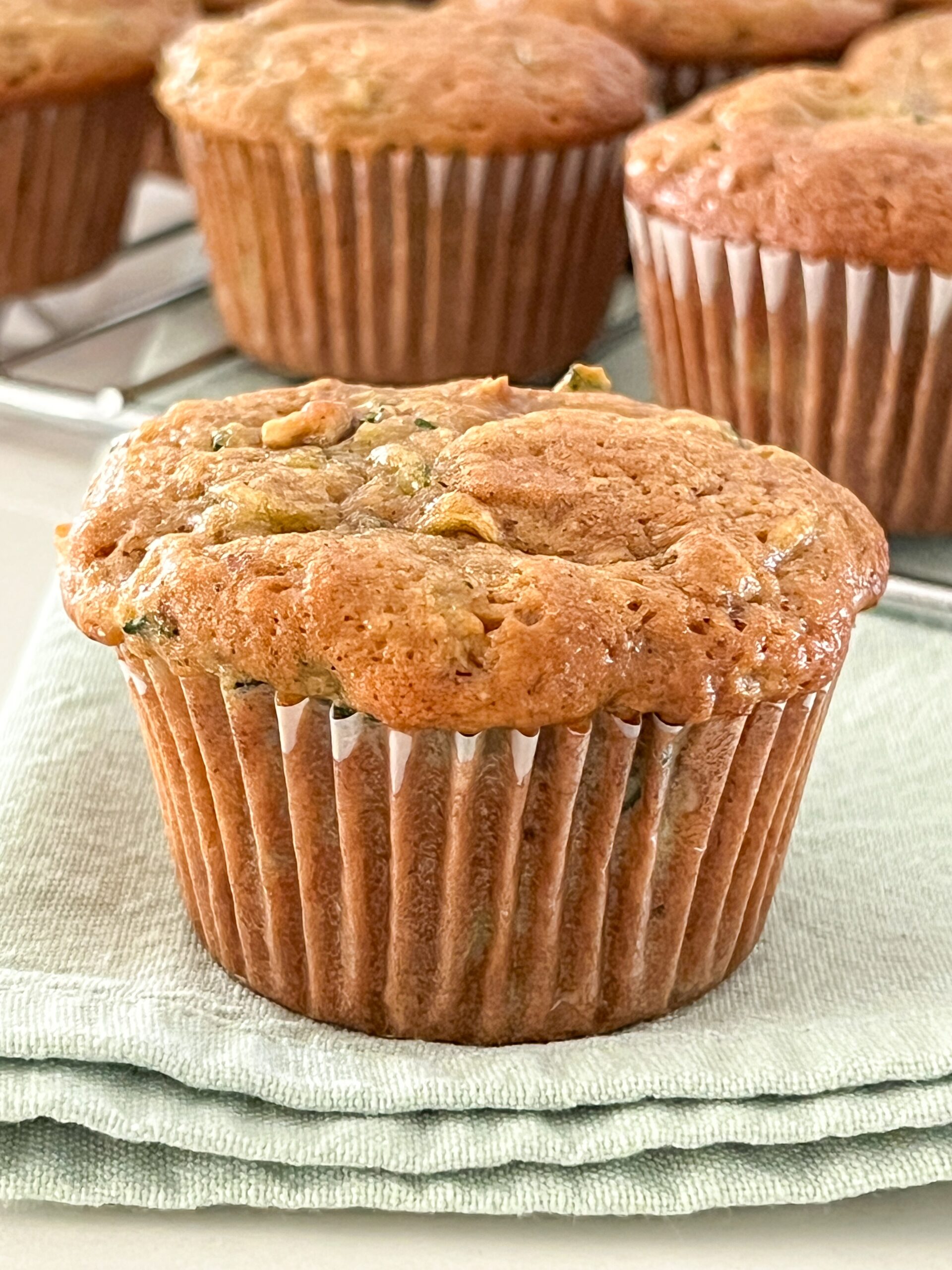 Zucchini,Muffins,On,A,Cooling,Rack,And,On,A,Light
