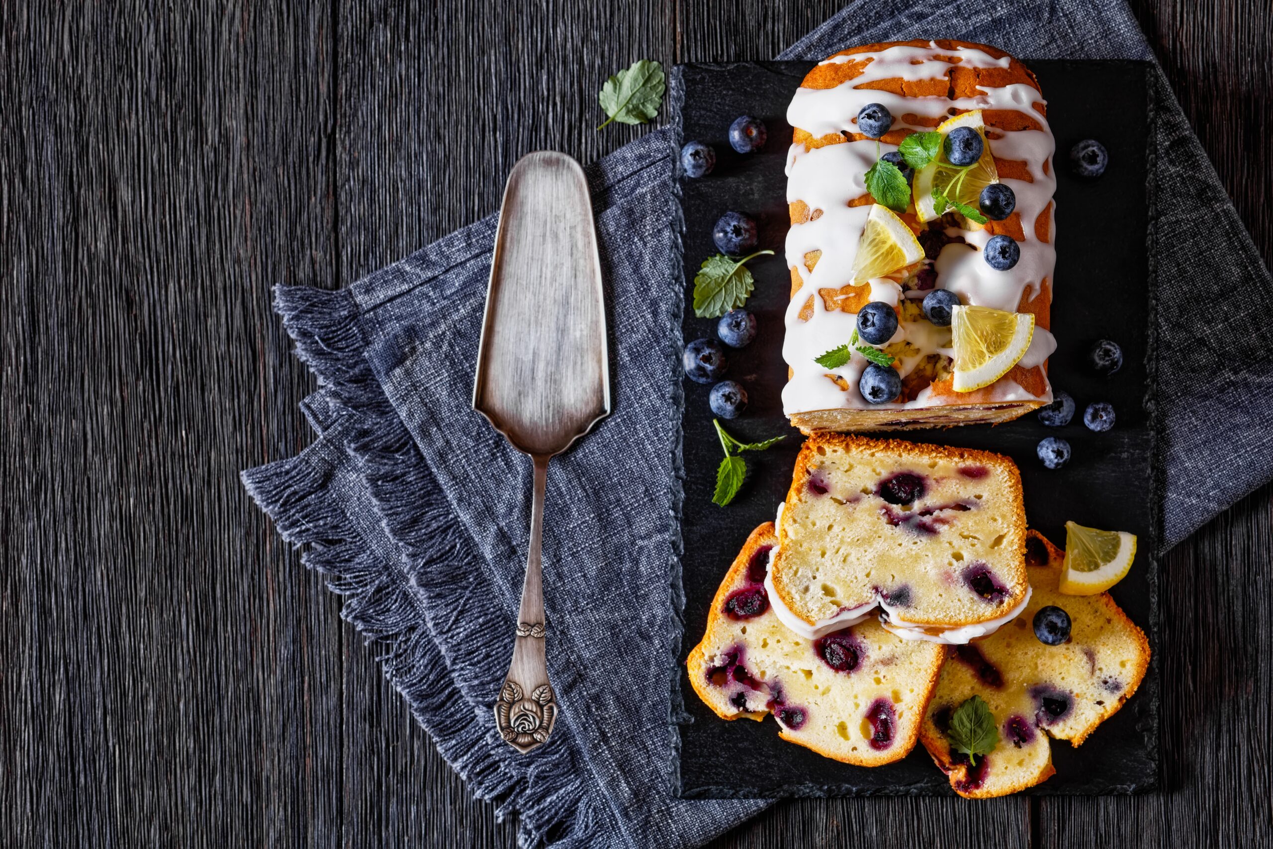 Lemon,Blueberry,Bread,With,Lemon,Glaze,On,Slate,Board,On